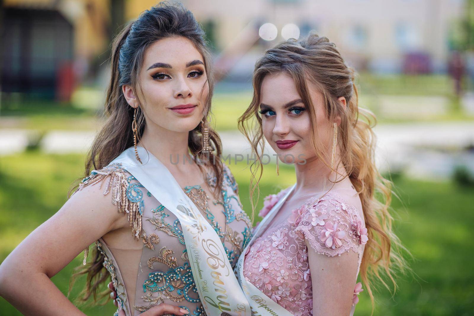 Beautiful schoolgirls in dress at the prom at school