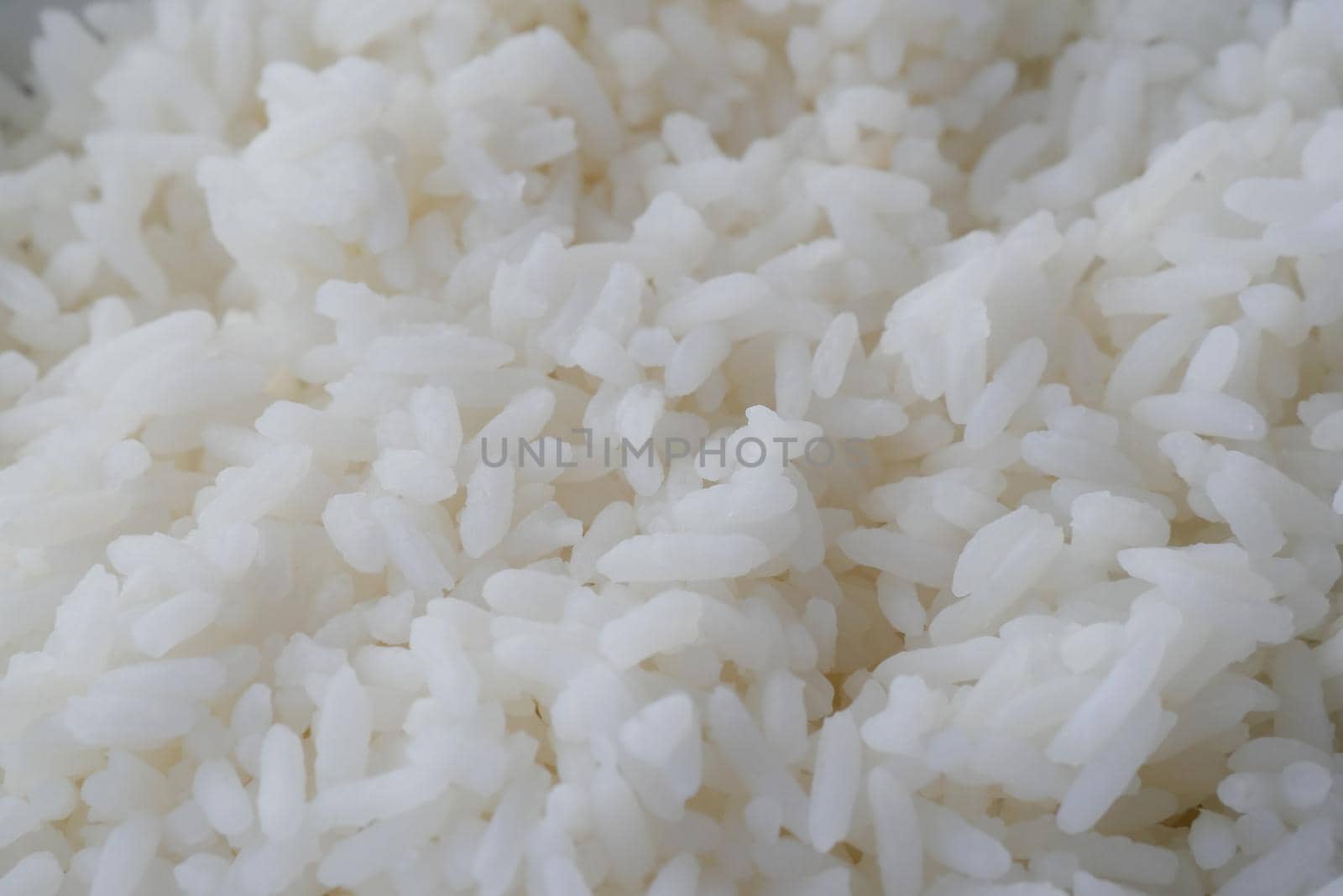cooked rice in a bowl on table, close up