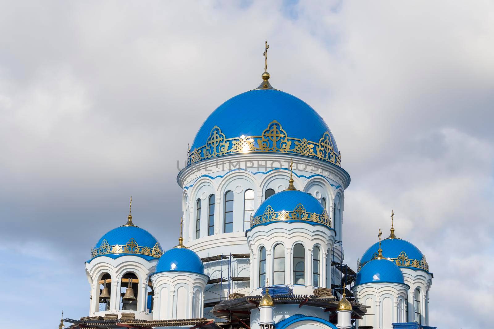 Orthodox Church in Russia Siberia. Gray sky. by Essffes