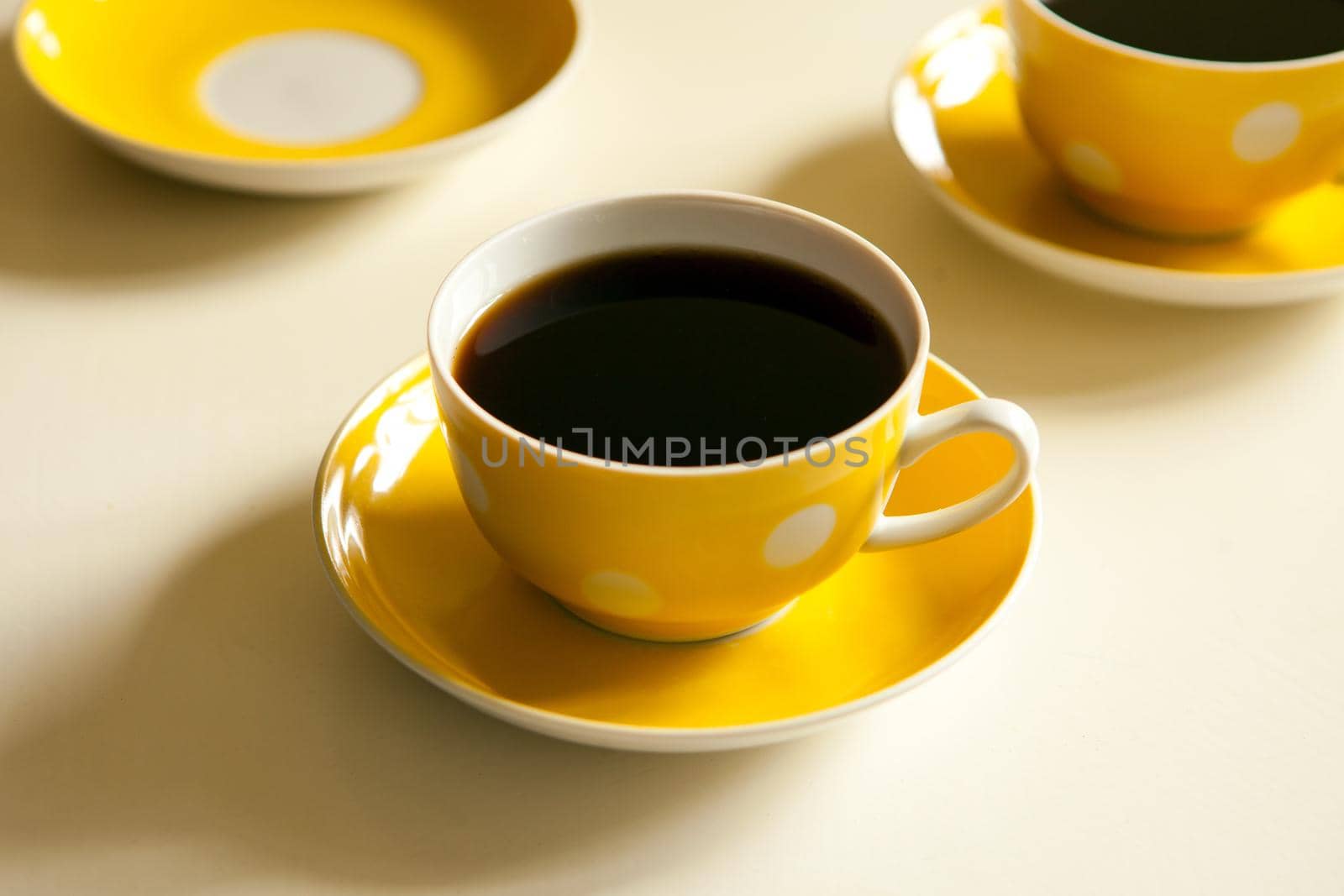 yellow cups with black tea. retro tea-set. vintage mug and plate by julija