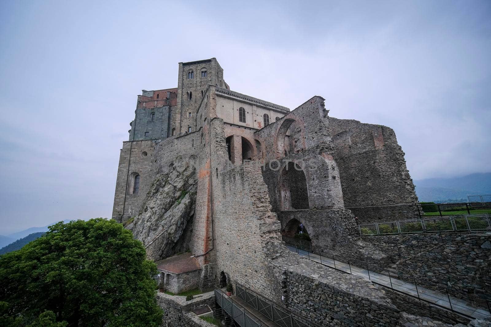 Sacra di San Michele in Turin, view from below of the cliff and walls. High quality photo
