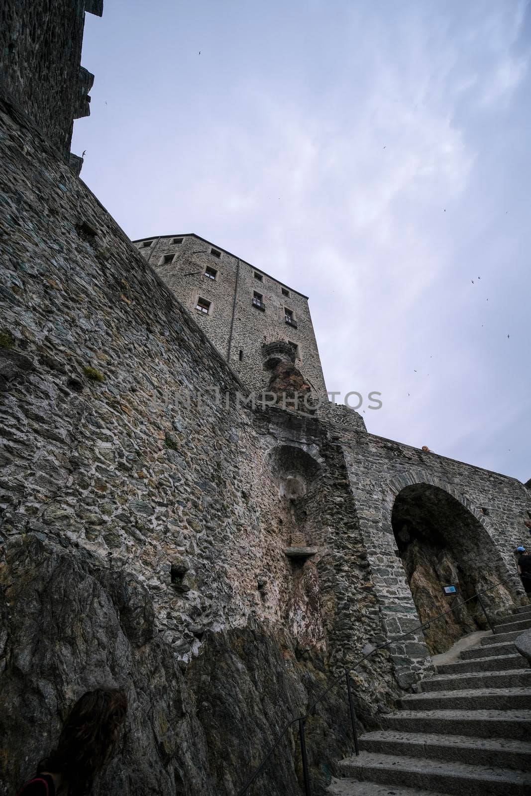 Sacra di San Michele in Turin, view from below of the cliff and walls. High quality photo