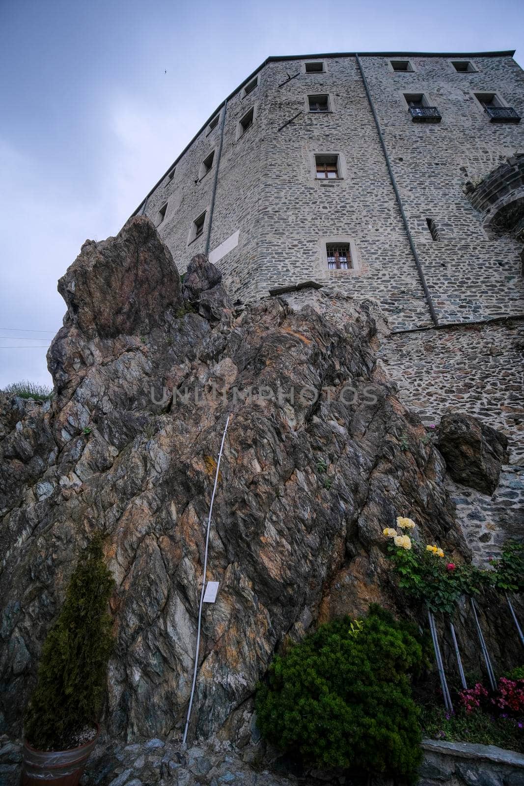 Sacra di San Michele in Turin, view from below of the cliff and walls. High quality photo