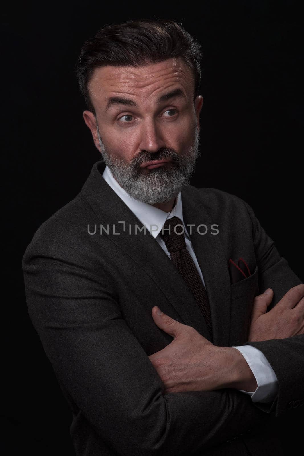 Frustrated middle aged elegant man Close up face of stressed businessman wearing stylish suit with eyes closed. Overworked middle eastern business man with terrible migrain by dotshock