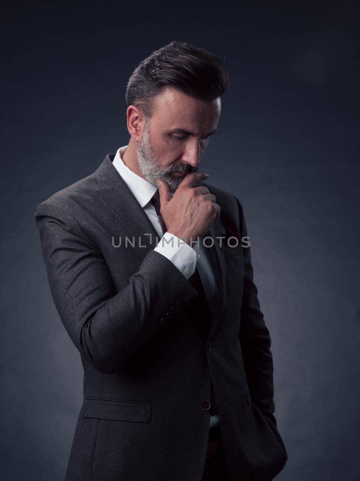 Frustrated middle aged elegant man Close up face of stressed businessman wearing stylish suit with eyes closed. Overworked middle eastern business man with terrible migrain by dotshock