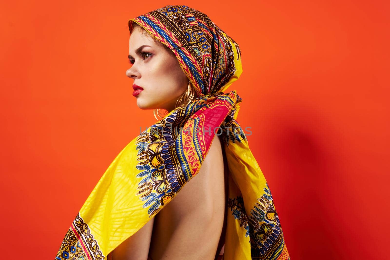 beautiful woman ethnicity multicolored headscarf makeup glamor Studio Model. High quality photo