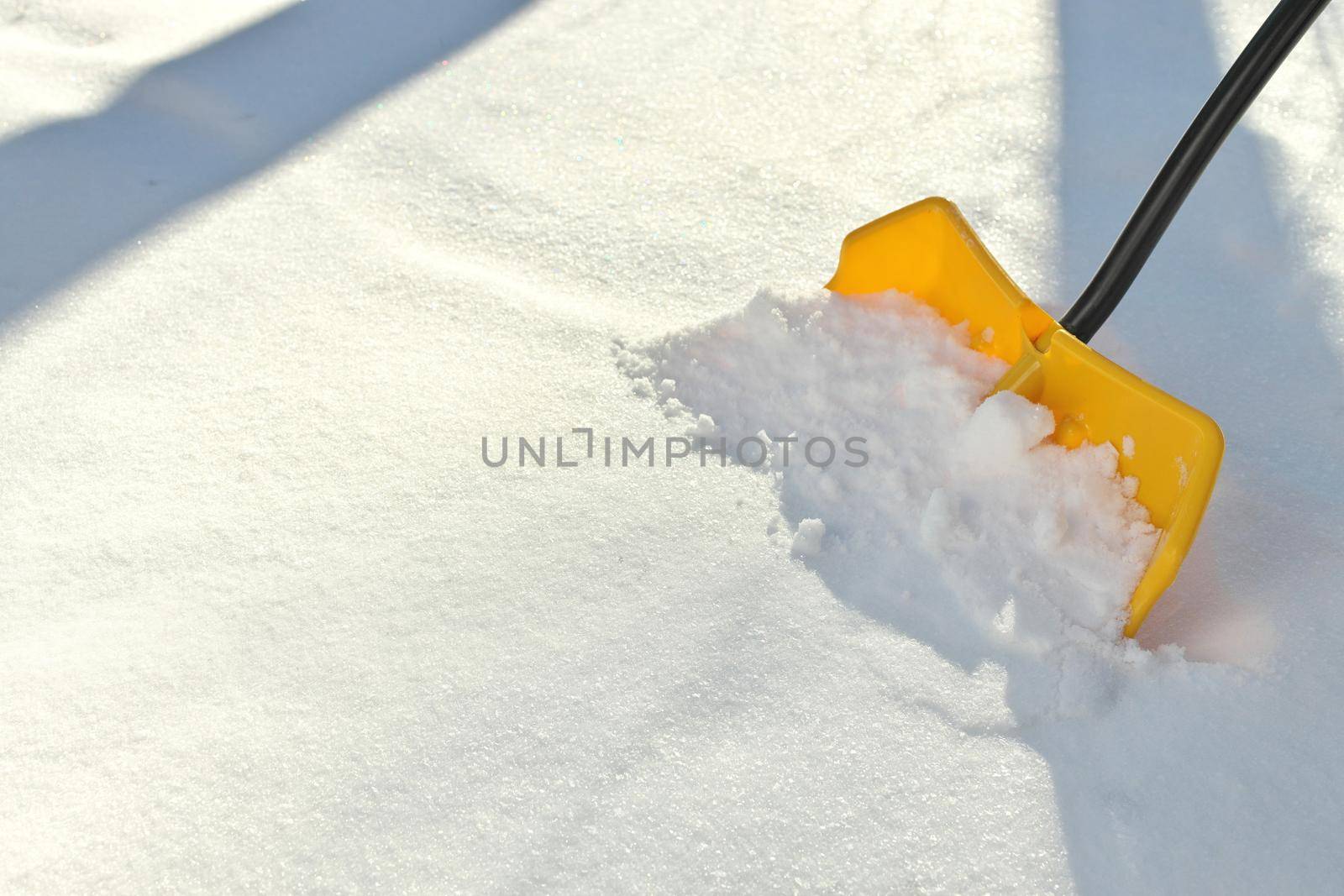 Yellow Snow Shovel Shoveling Fresh, Deep Powdery Snow by markvandam