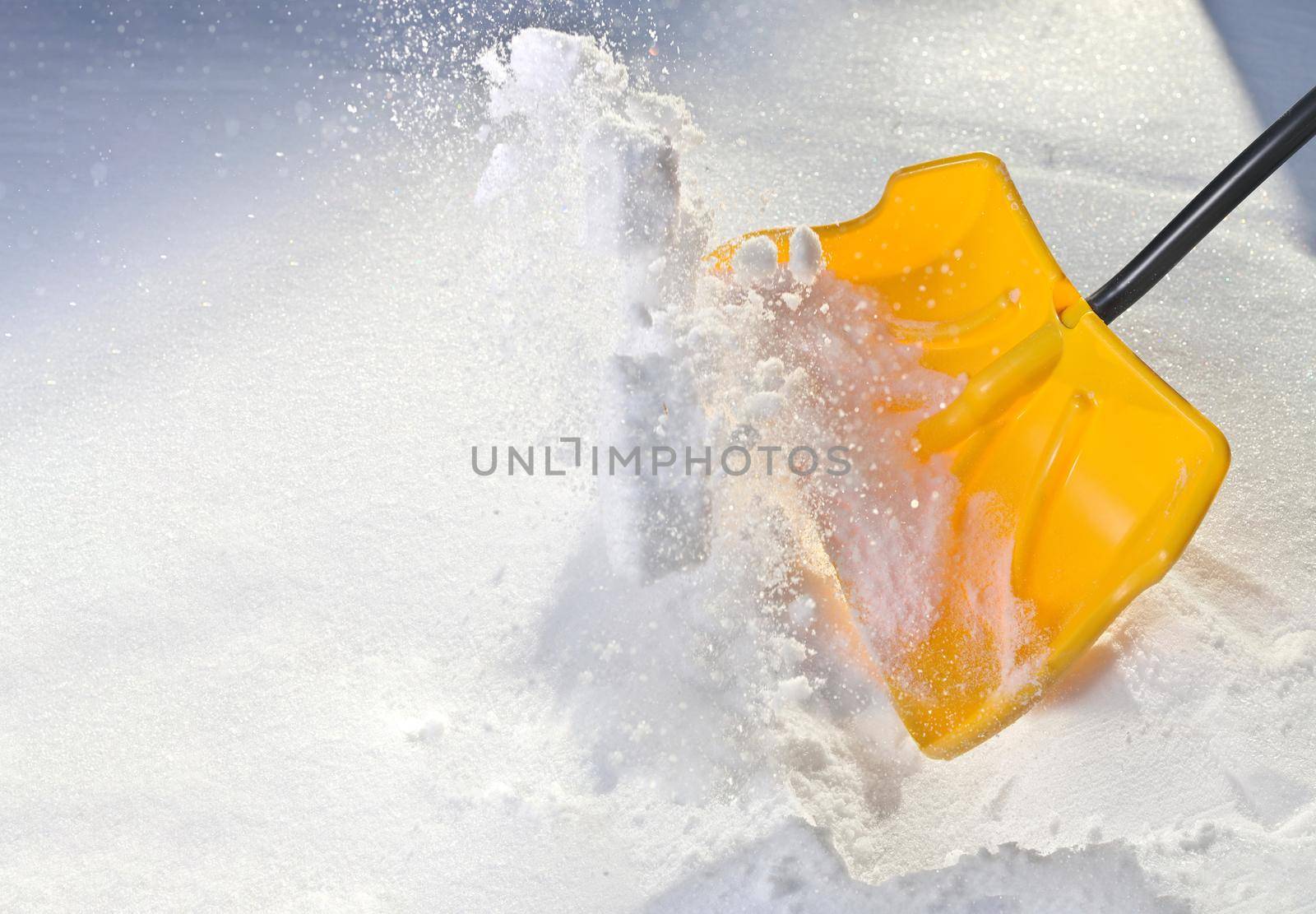 Yellow Snow Shovel Shoveling Fresh, Deep Powdery Snow by markvandam