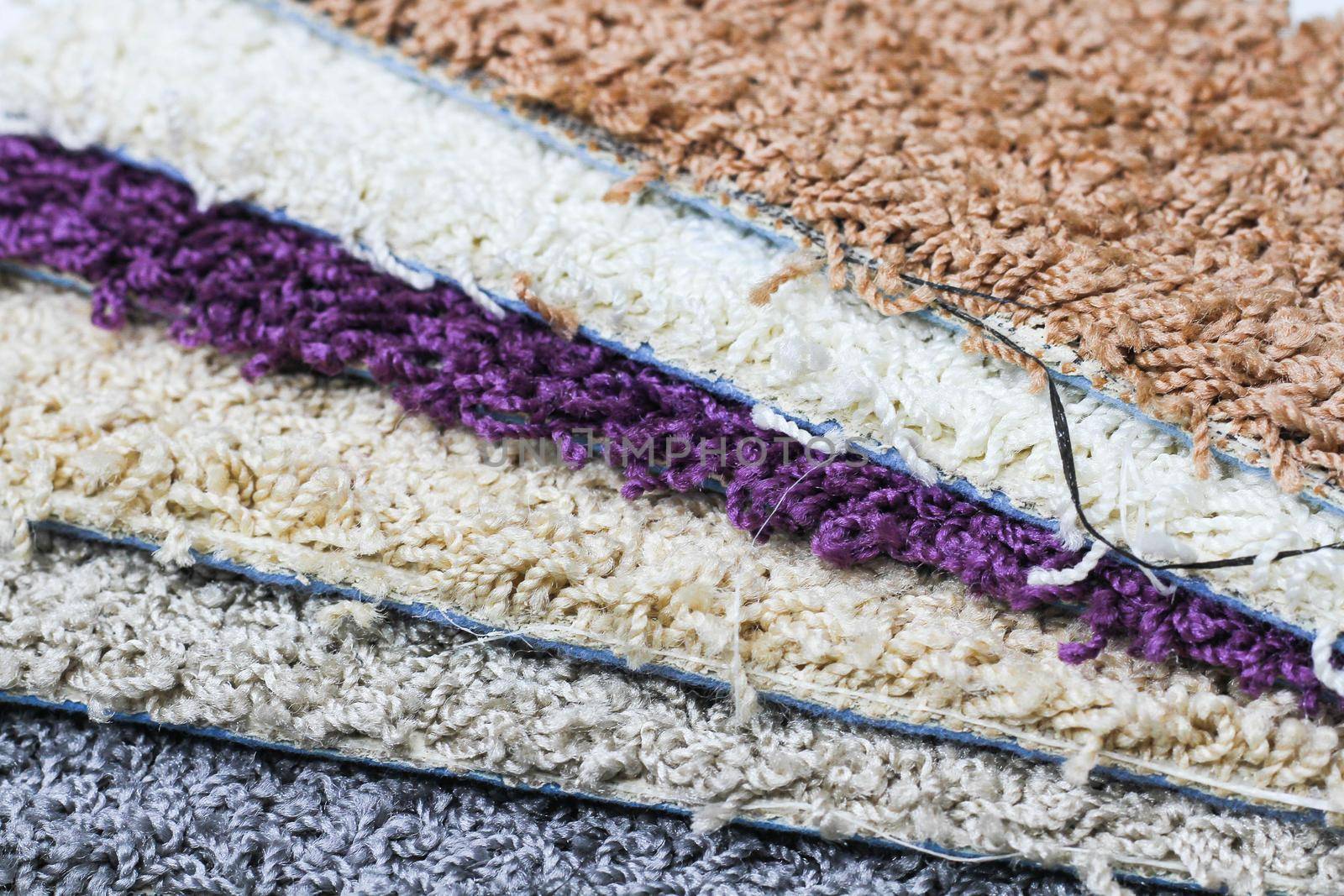 Carpet. Samples of carpets for the home. Multi-colored patterns. Pile close-up. Close-up carpet texture.