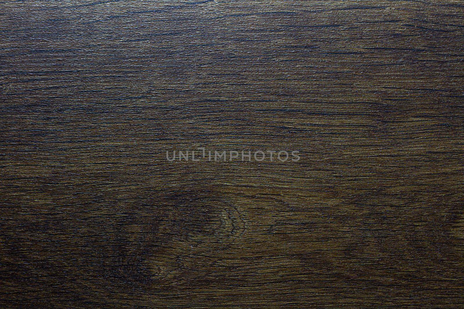 Wood texture. Wooden board close up. The cracks are deep. Laminate flooring. Tree rings in a cut.