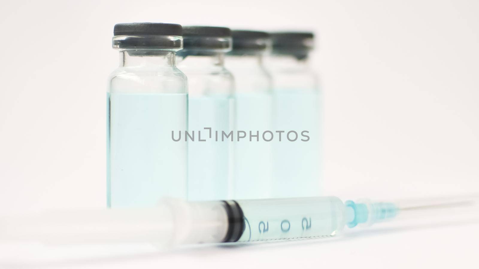 Medical ampoules and insulin syringe isolated on white background, vaccination concept by balinska_lv