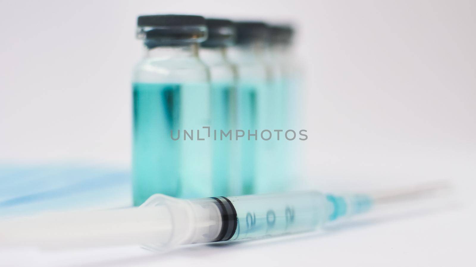 Medical ampoules and insulin syringe isolated on white background, vaccination concept by balinska_lv