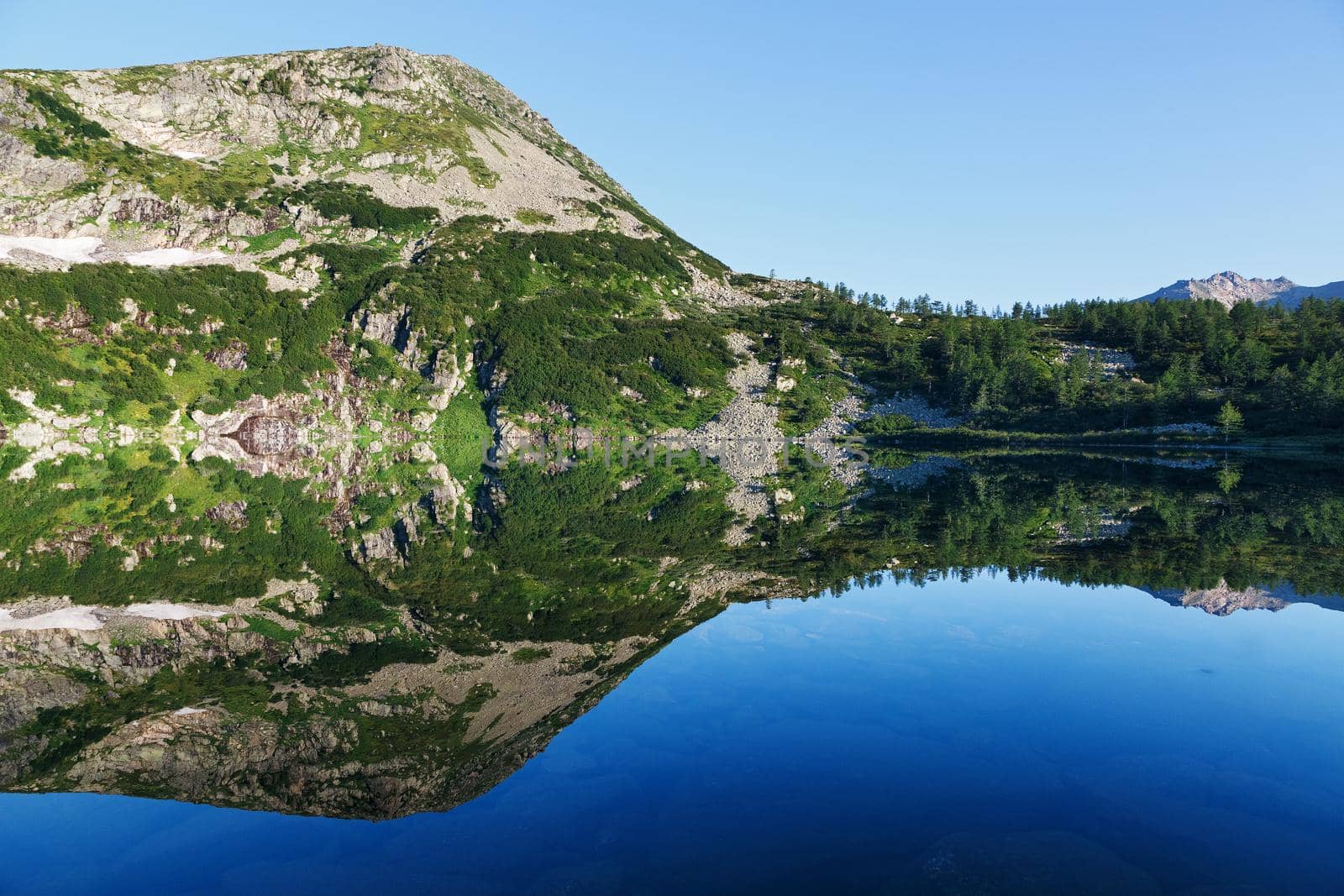 reflection of the mountain on water, mirror image of mountains in water by AlexGrec