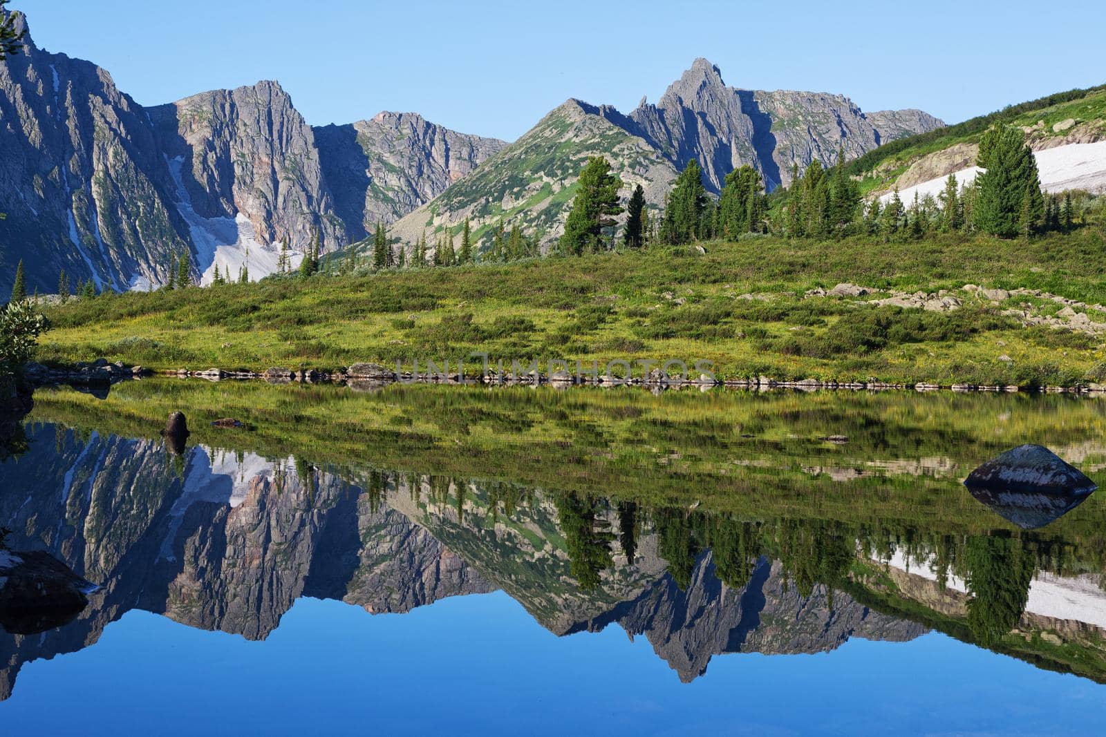 reflection of the mountain on water, mirror image of mountains in water Location: Siberia, the Golden Valley