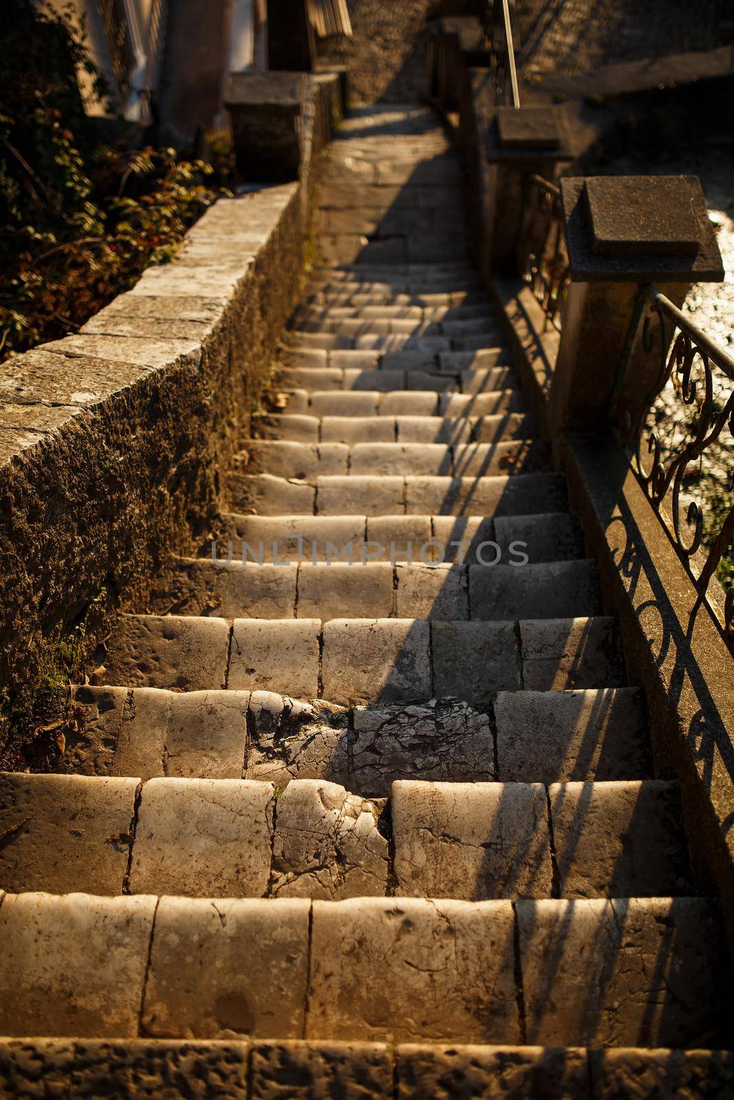 stairs and wall from pebble rock stone. Beautiful rock stairs and rock wall with cement steps, architecture from natural materials concept. Abkhazia