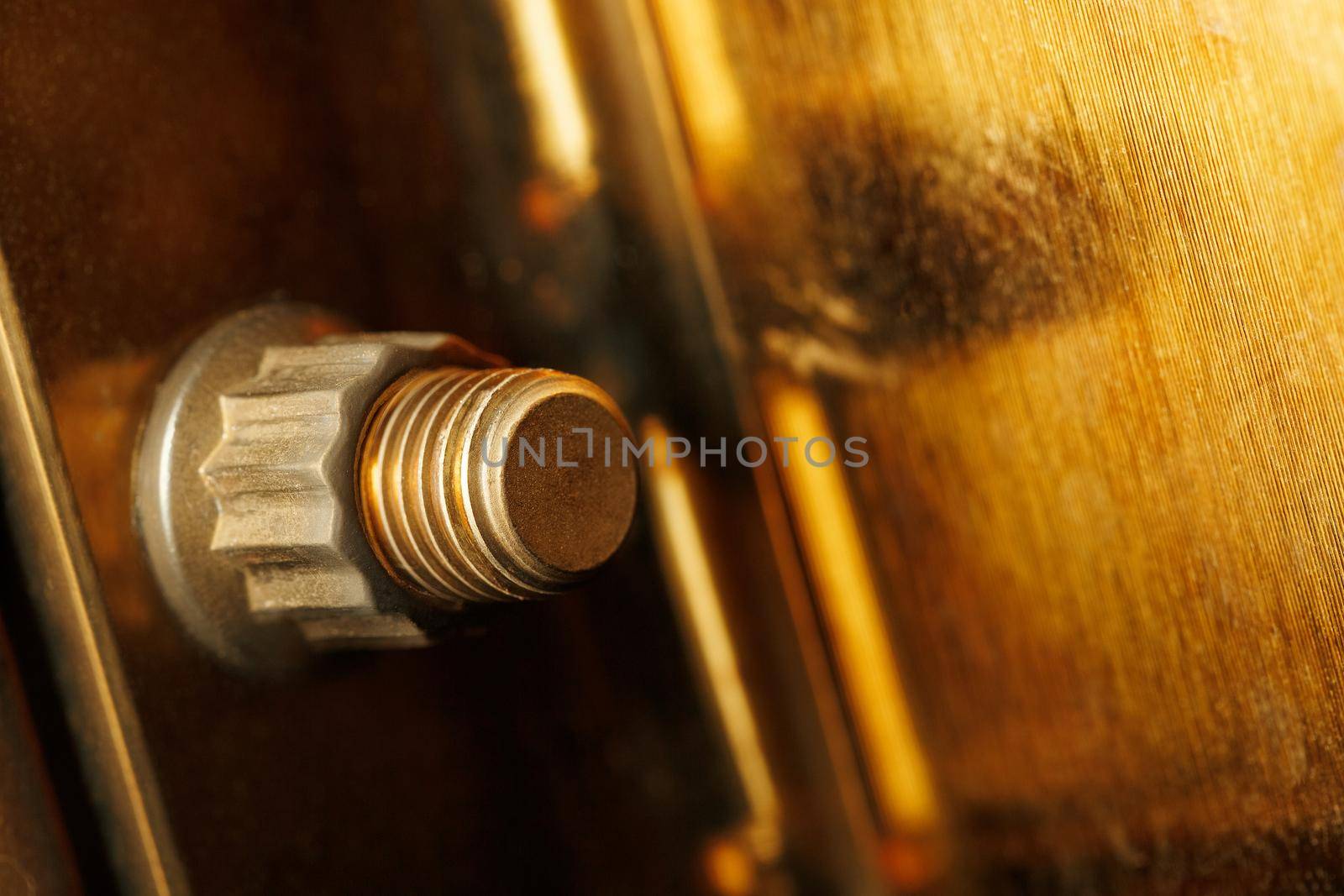 Close up metal nut on bolt by AlexGrec
