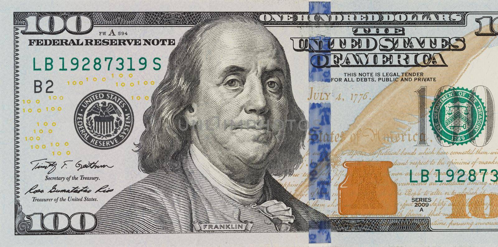 The denomination hundred dollars on isolated white background. new