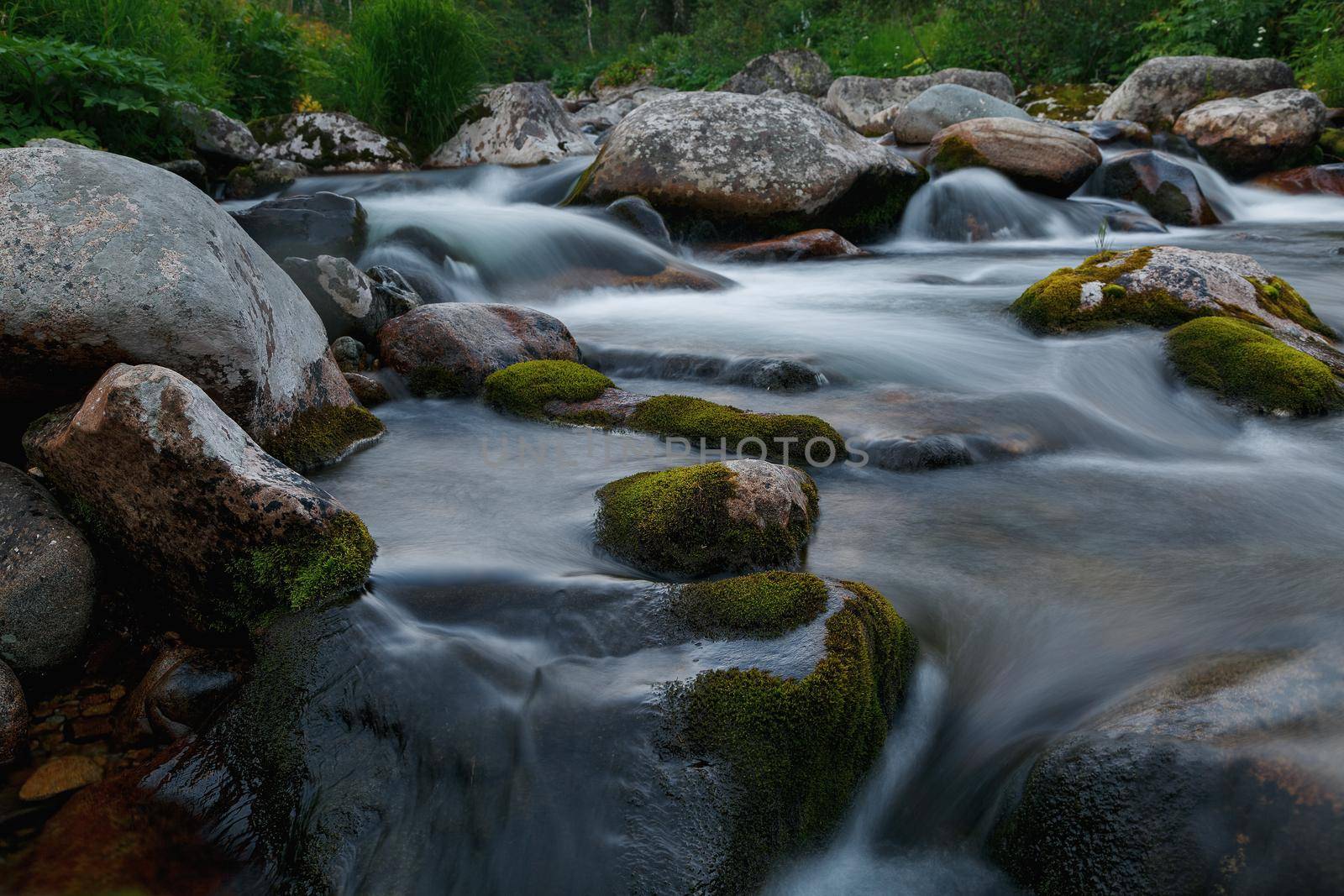 Small rivers with stones in long exposure by AlexGrec