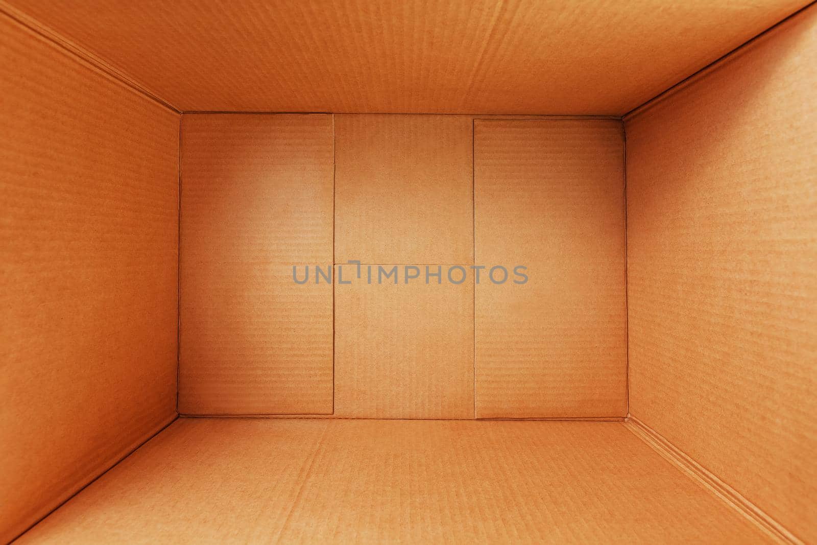 Empty cardboard box, inside view. Empty space for cargo, parcel and gift. Open cardboard box isolated on white background. Top view.