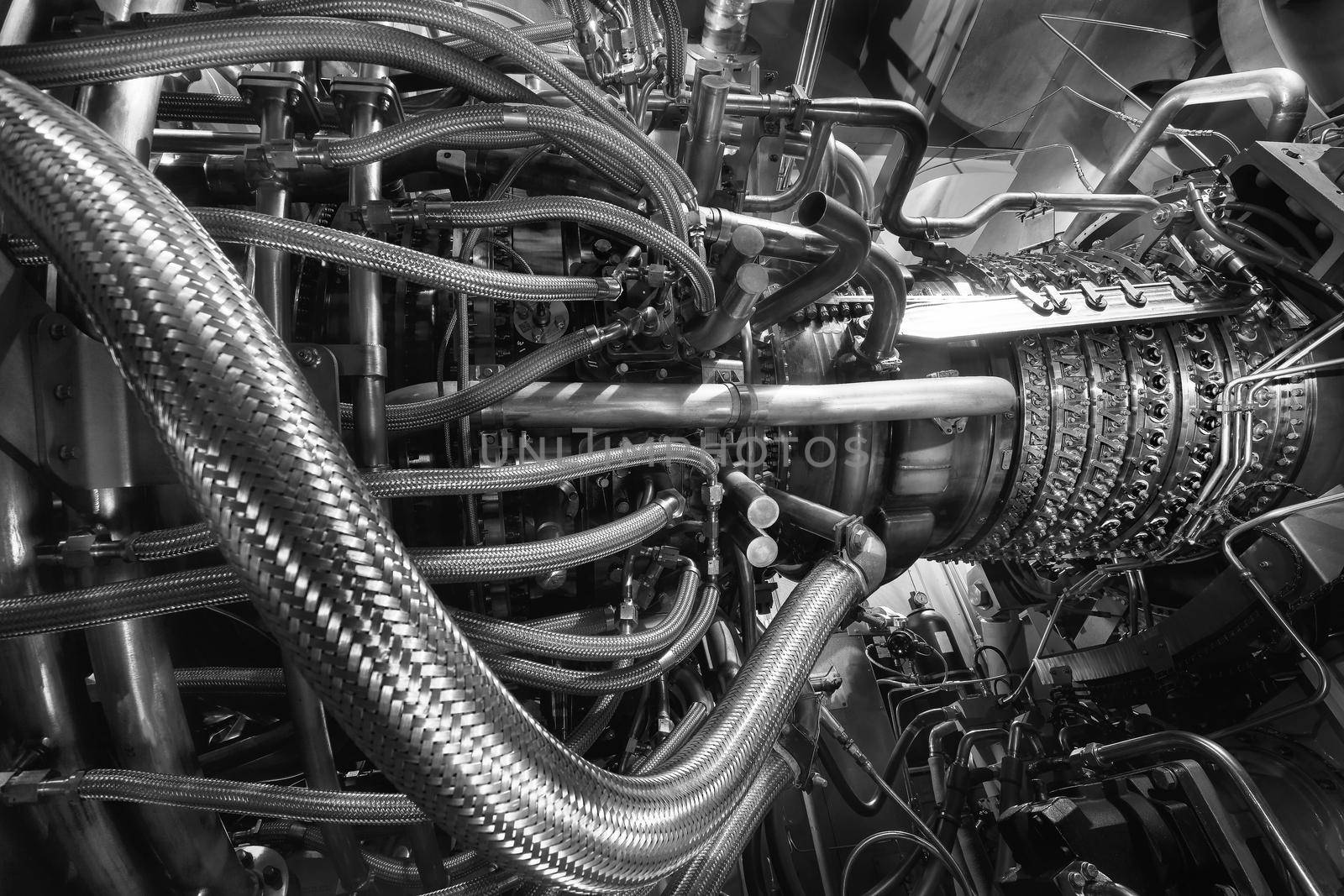 Gas turbine engine of feed gas compressor located inside pressurized enclosure, Black white monochrome. The gas turbine engine used in offshore oil and gas central processing platform. Technological ecological installation