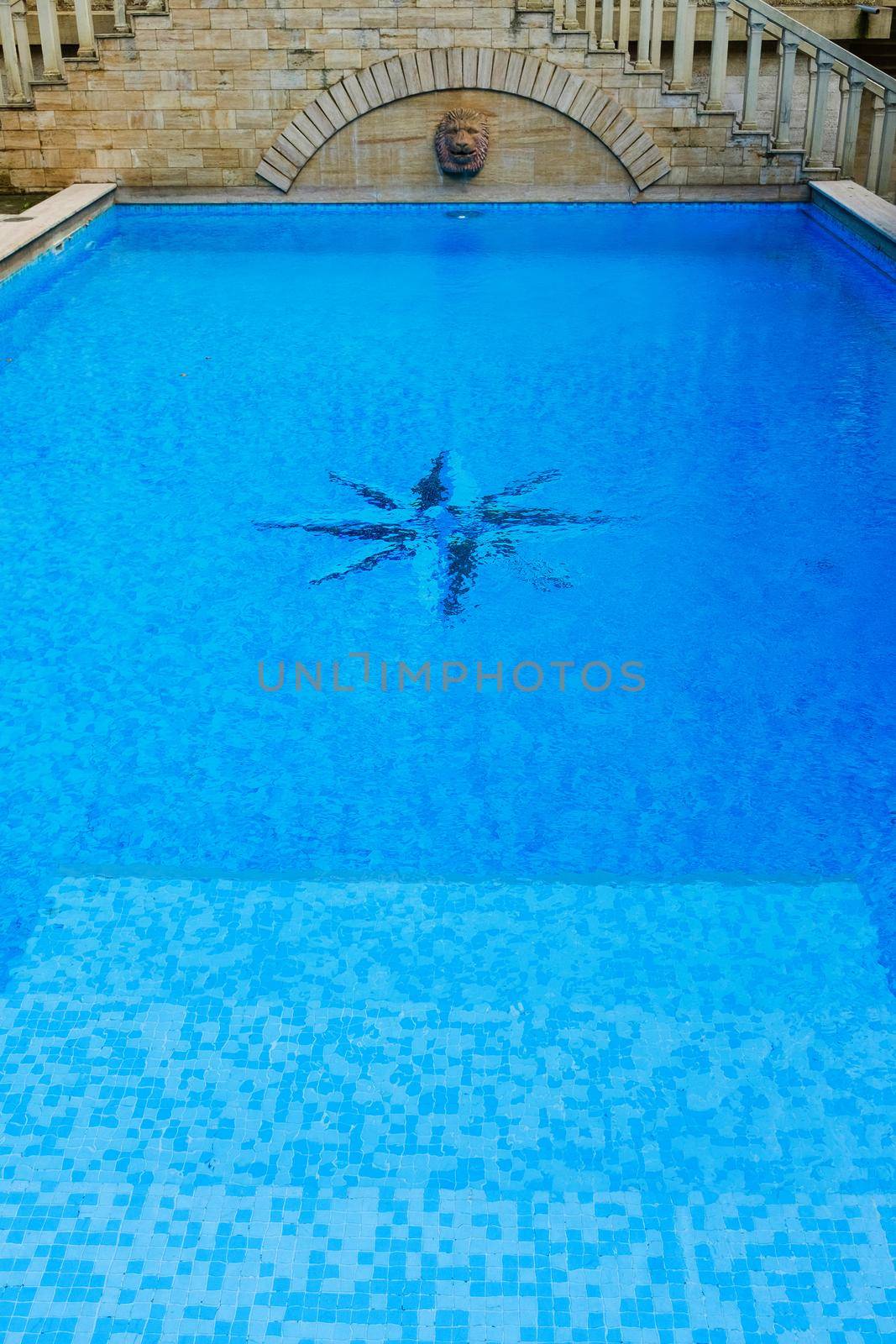 surface of blue swimming pool,background of water in swimming pool. by AlexGrec