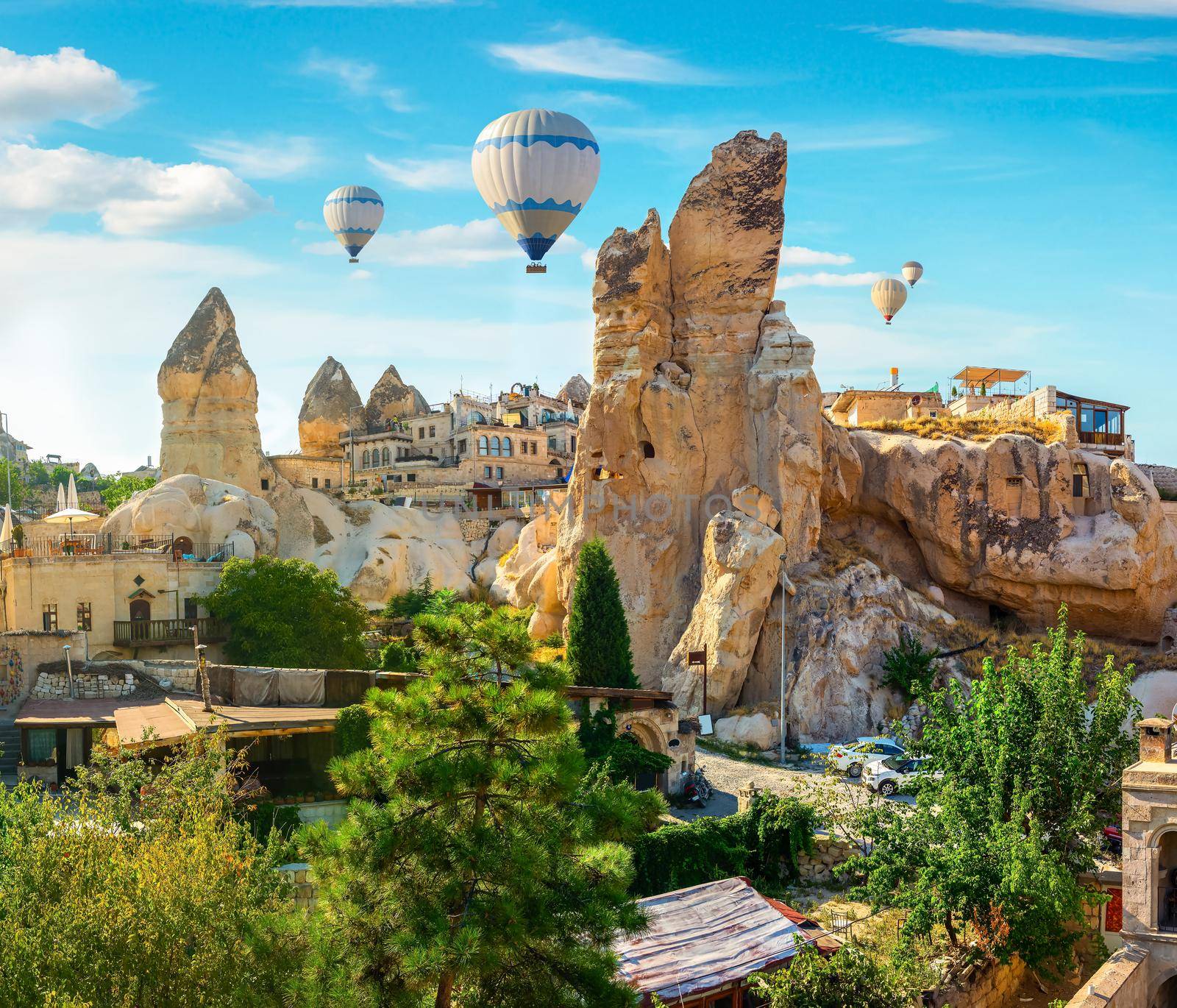 Hot air balloons at day in Goreme village, Cappadocia, Turkey