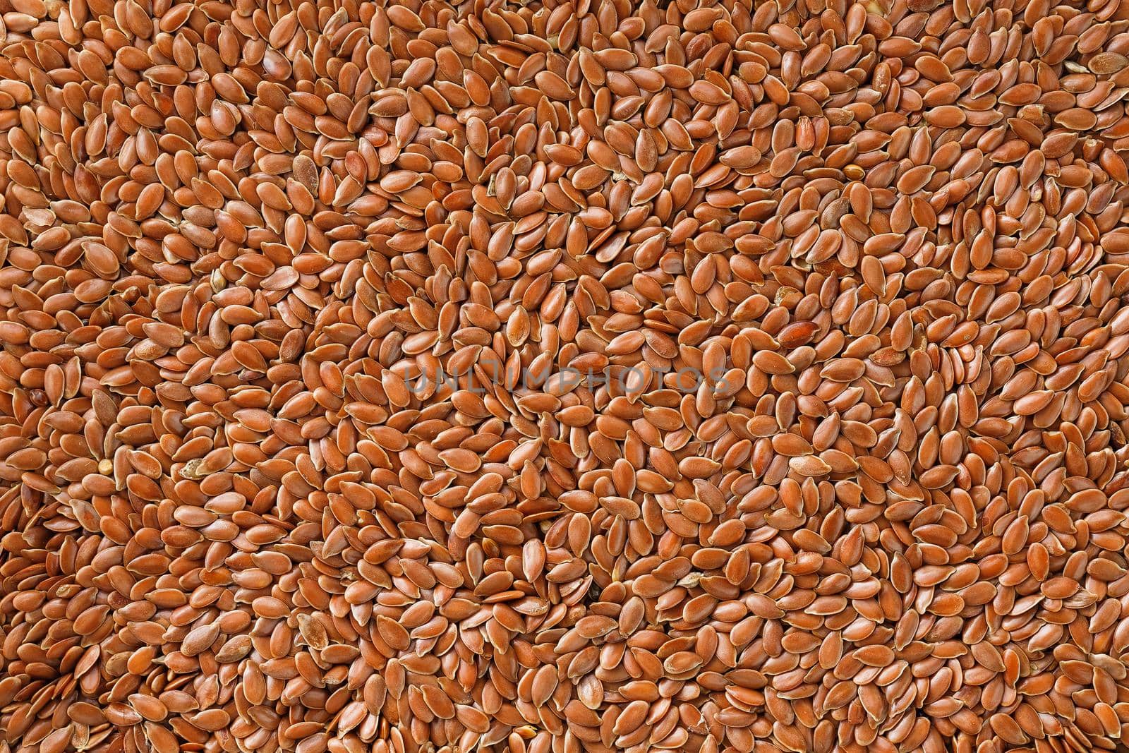 Background texture of seeds of dark brown flax. by AlexGrec