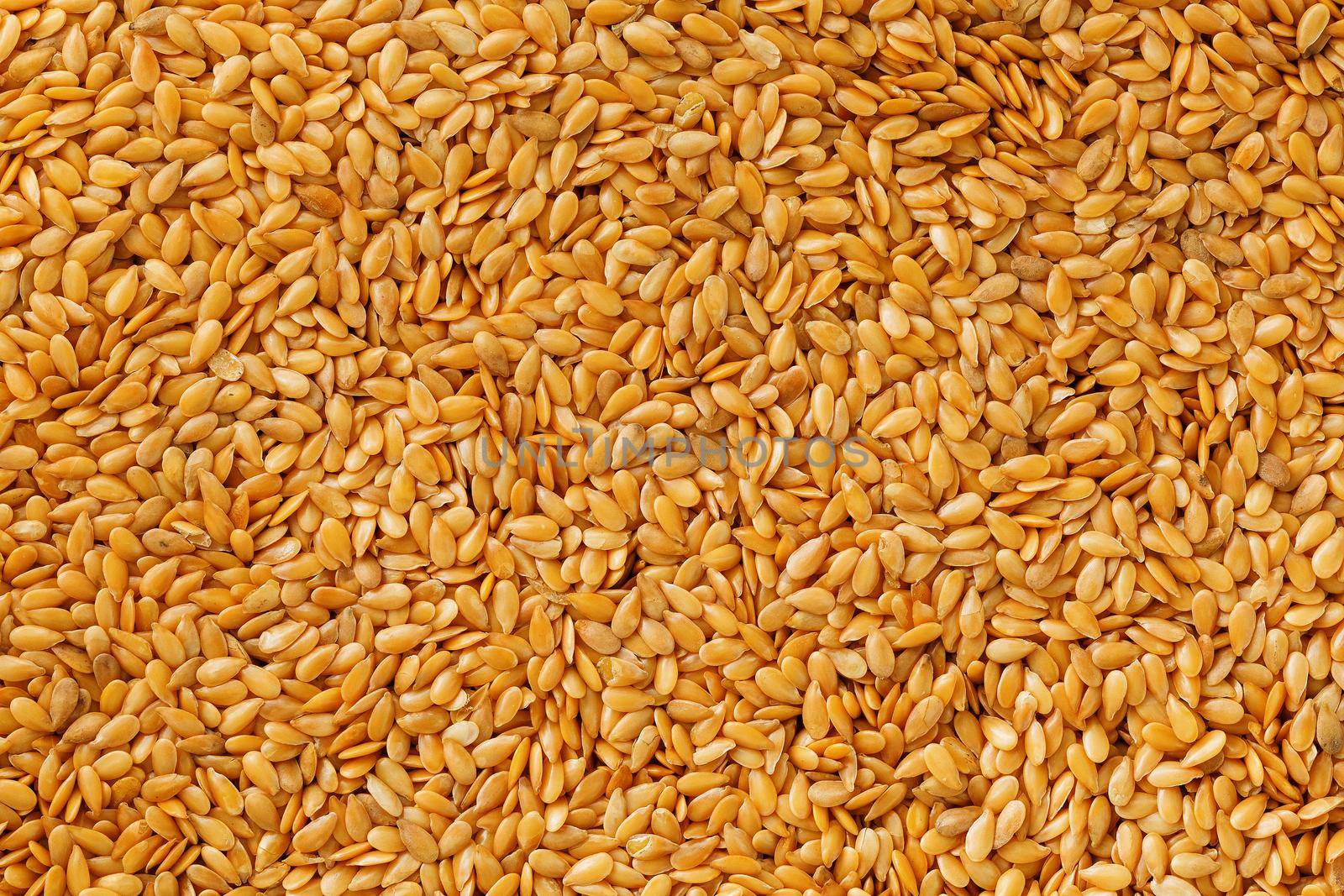 Background texture of white flax seeds. Grain for oil. Useful cereals.