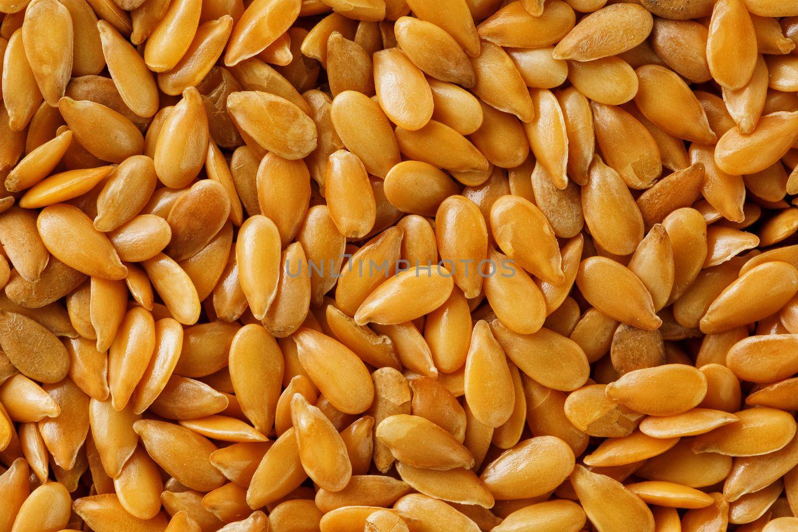 Background texture of white flax seeds. Grain for oil. Useful cereals.
