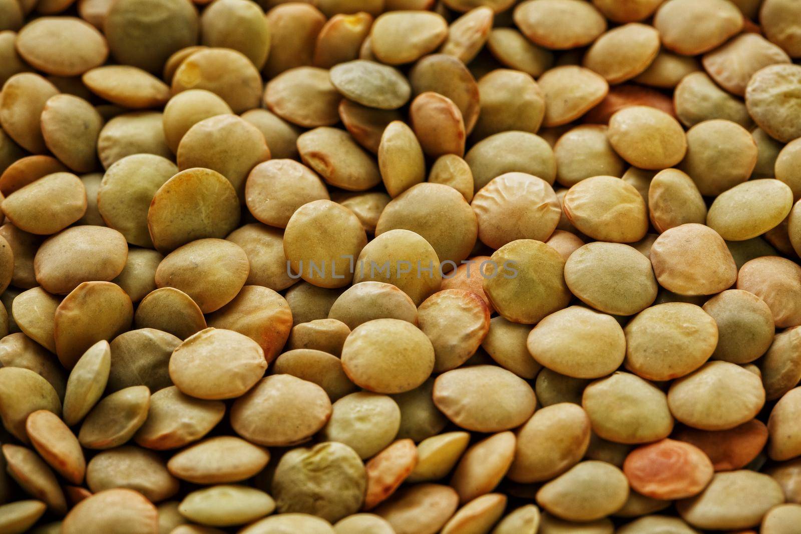 Lentils. Lentils background. Green lentils pattern. Natural organic lentils for healthy food by AlexGrec