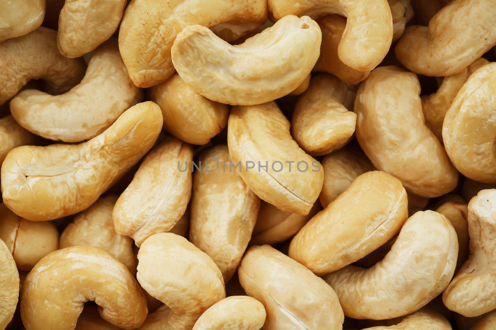 Organic Cashew with no shell on a background by AlexGrec