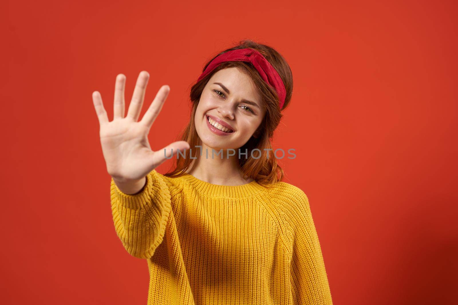cheerful woman in yellow sweater red headband decoration fashion street style by SHOTPRIME