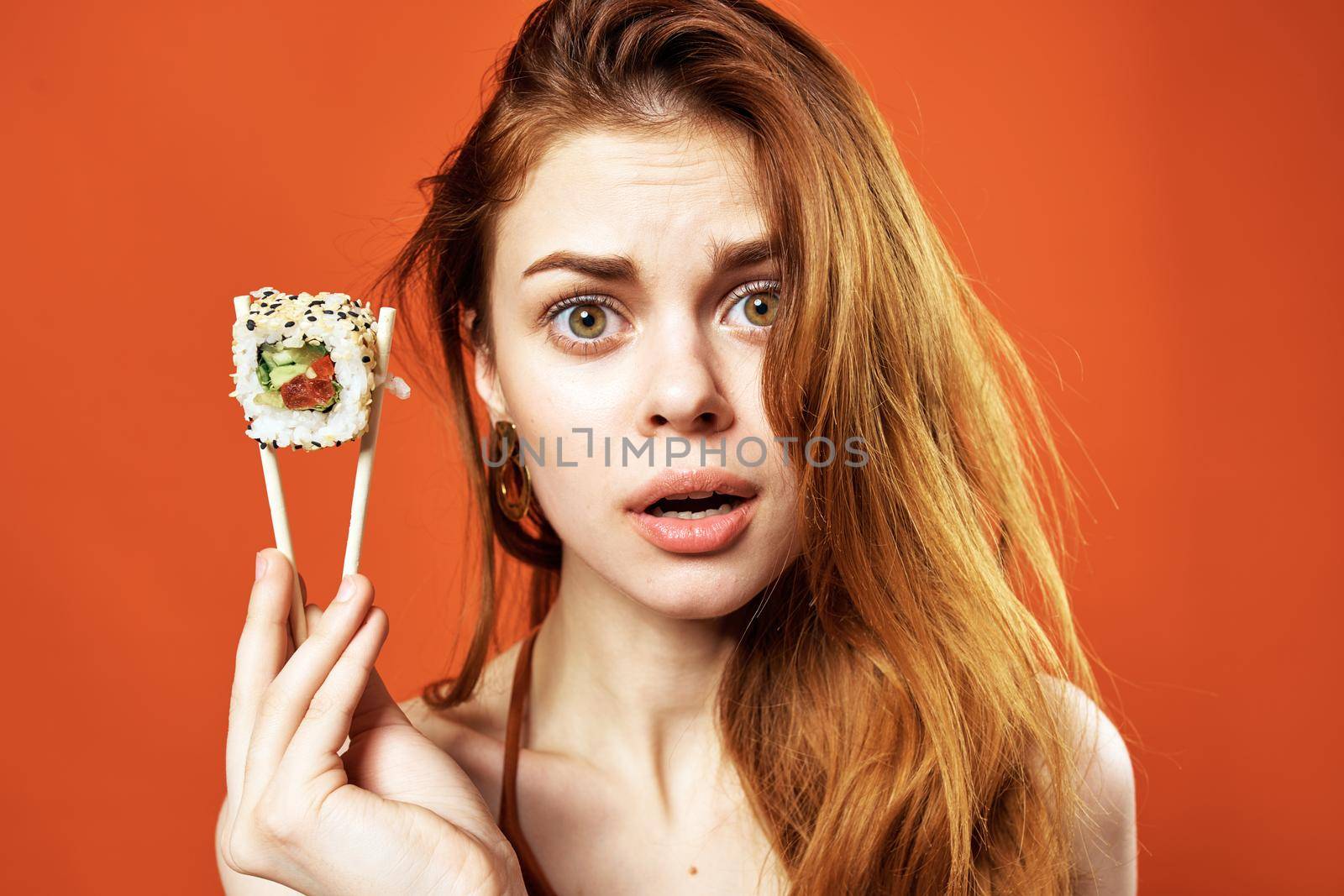 woman with chopsticks sushi rolls japanese cuisine snack by SHOTPRIME