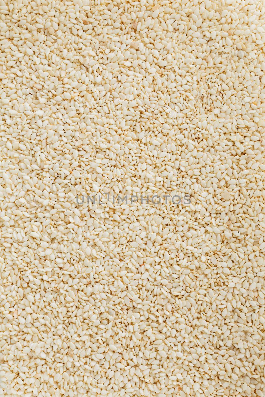 White sesame seeds background. Useful seeds for cooking.