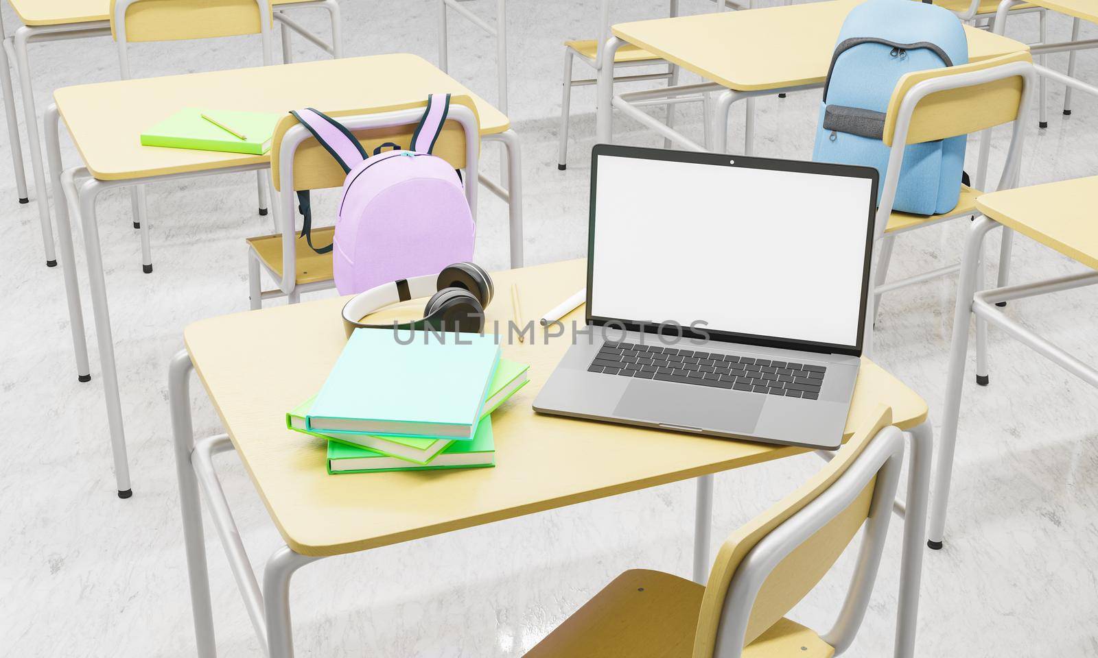 laptop on a school desk in a classroom with books and supplies around by asolano