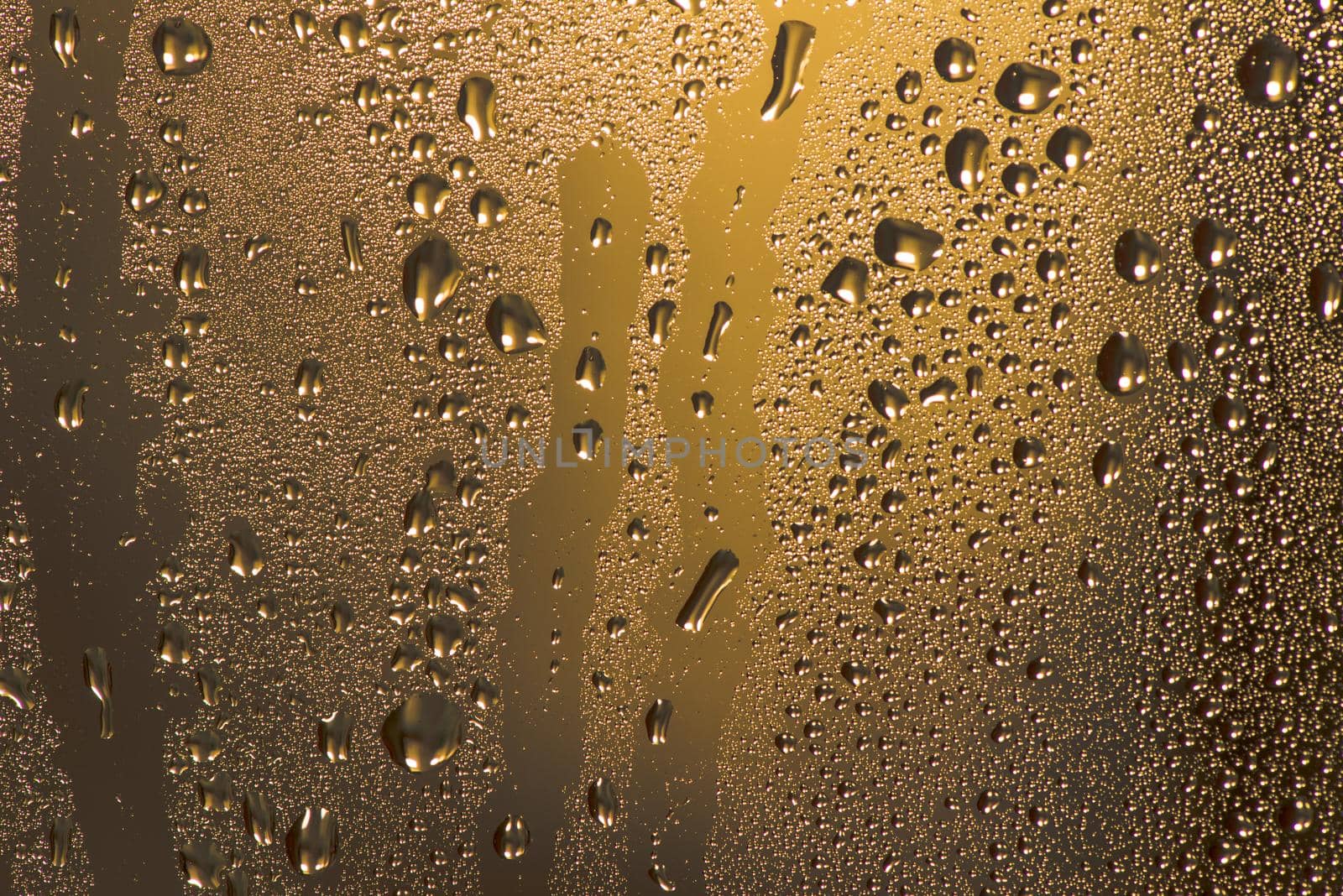 Natural water drops on glass.