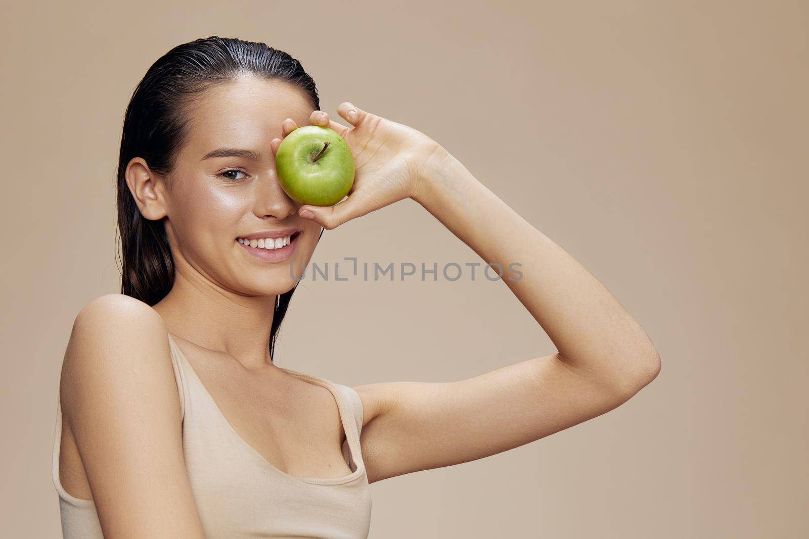 portrait woman apple in hands posing fruit healthy food fresh close-up Lifestyle. High quality photo