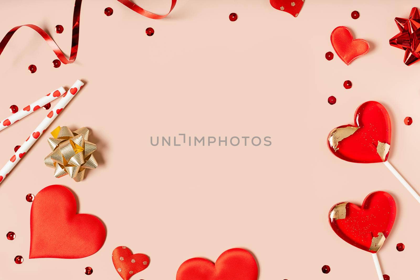 Background with gift, confetti and hearts lollipops with free space for text on pink background. Valentines day concept. Mother's Day concept. Mockup Greetings card. Copy space. Flat lay, top view.