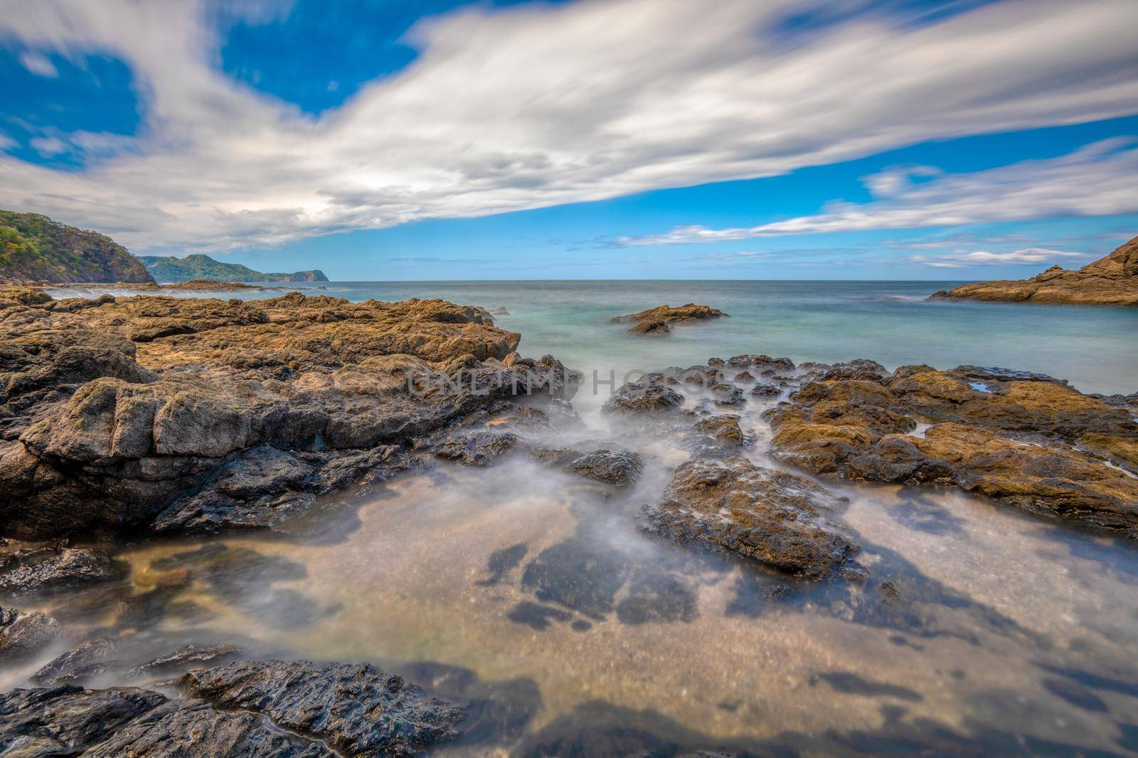 Long exposure, pacific ocean waves on rock in Playa Ocotal, El Coco Costa Rica by artush