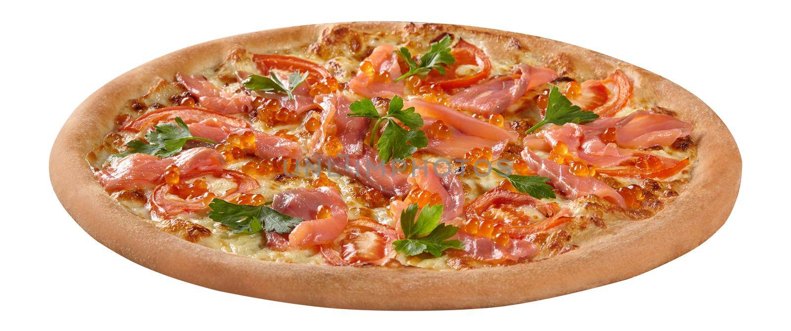 Closeup of thin slices of smoked salmon and red caviar on top of freshly baked pizza with cream cheese sauce, melted mozzarella and tomatoes garnished with fresh parsley. Delicious Italian snack