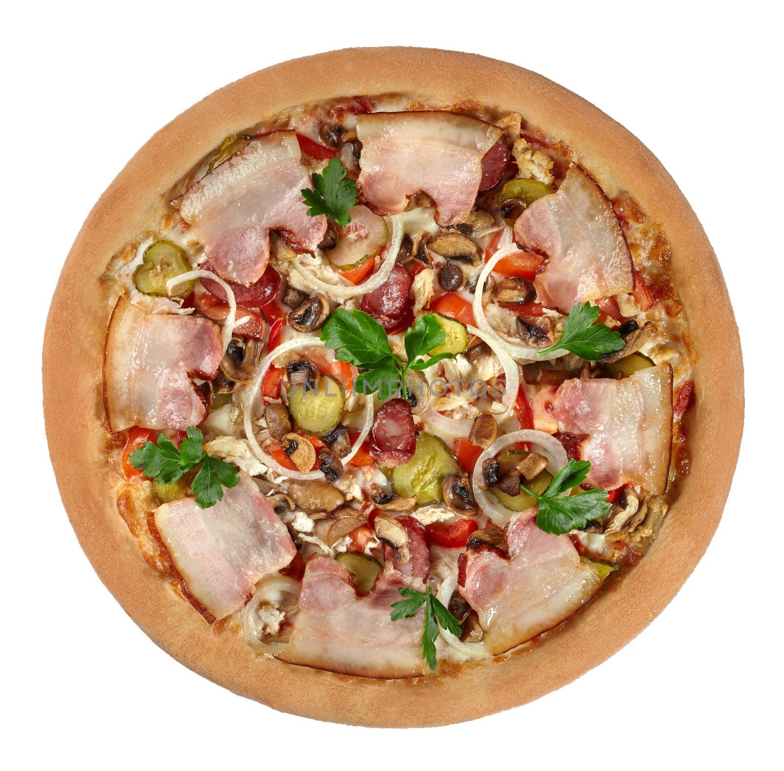 Hearty pizza in rustic style with chicken, hunting sausages and bacon in combination with pickles, mushrooms, onions and greens based on cheese sauce. Top view isolated on white background