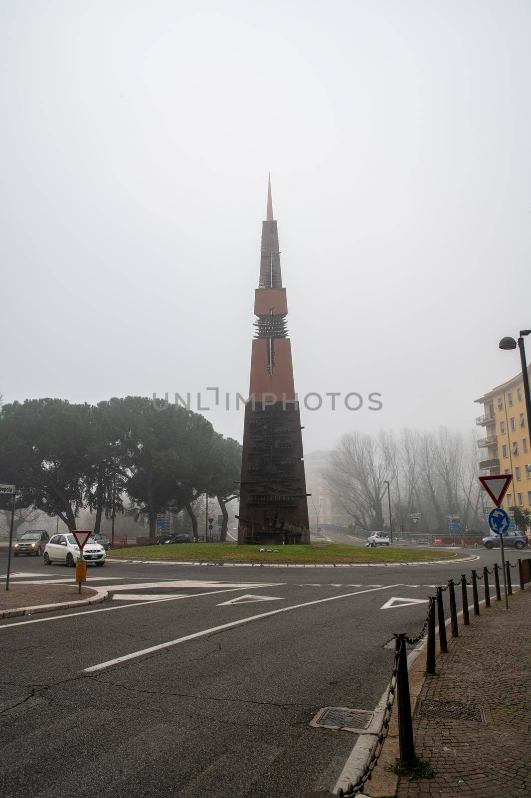 terni obelisk by Arnaldo Pomodoro with fog by carfedeph