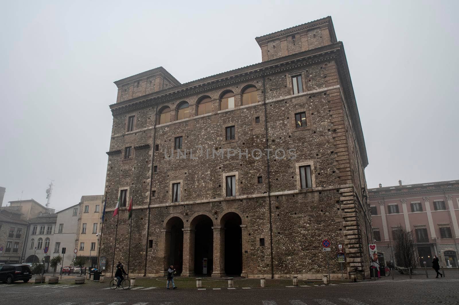 terni,italy january 17 2022:terni square of people and the town called Palazzo Spada with fog