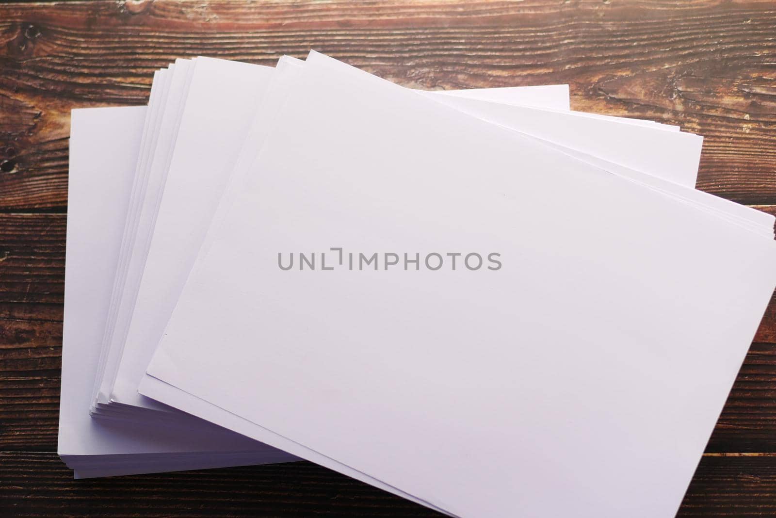 top view of stack of empty paper on table .