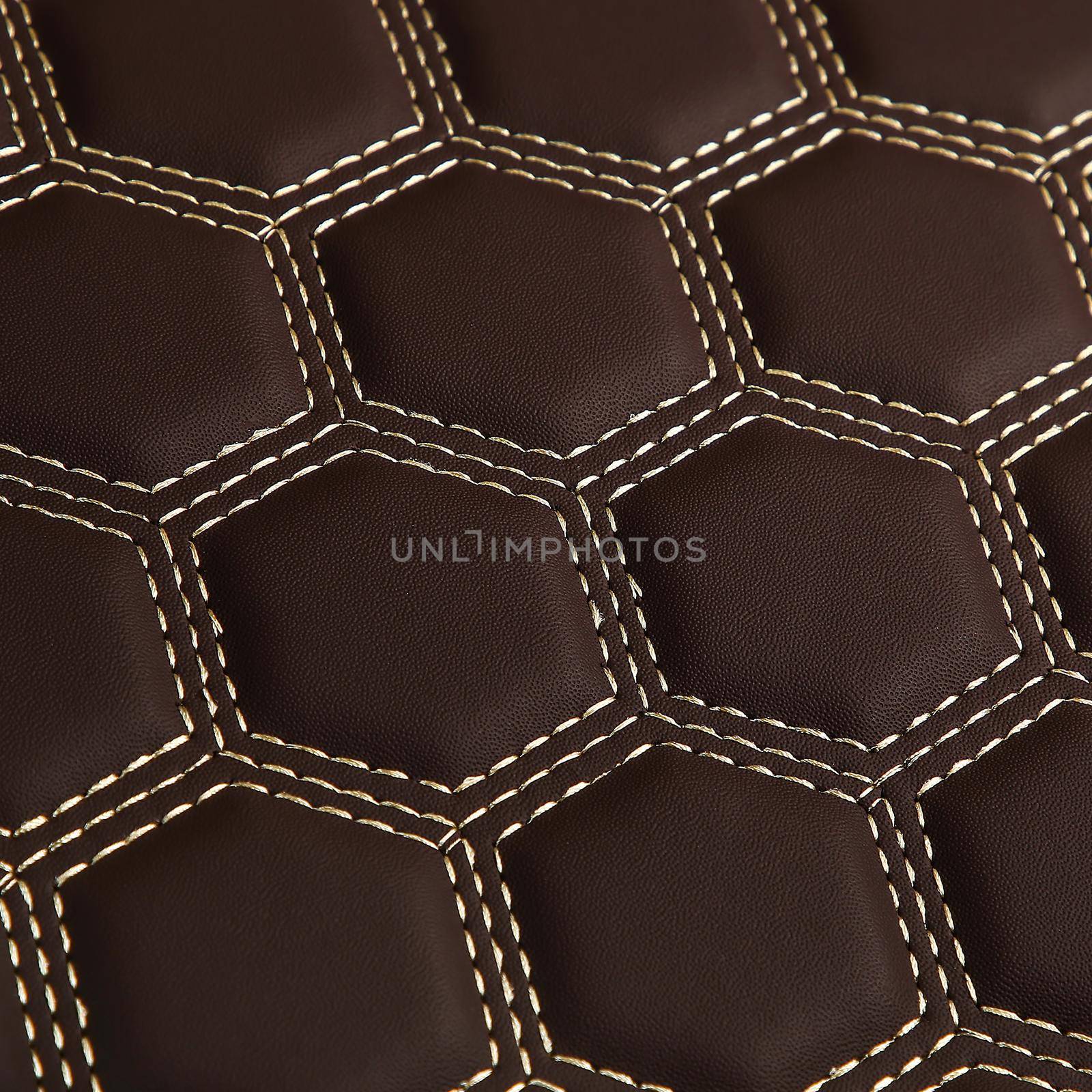 Texture of brown leather background with square pattern and stitch, macro