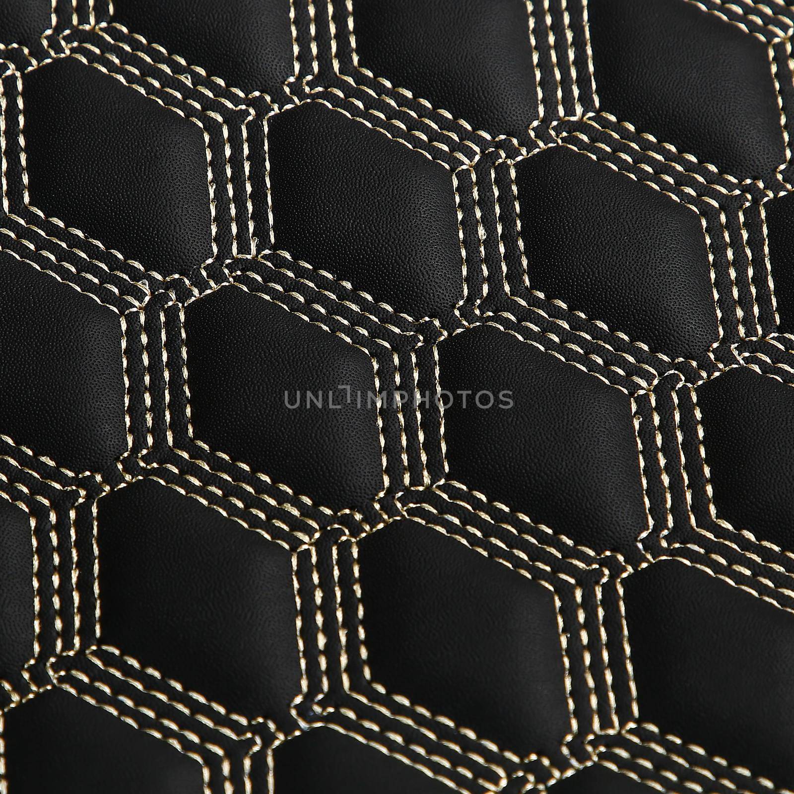 Texture of black leather background with square pattern and stitch, macro