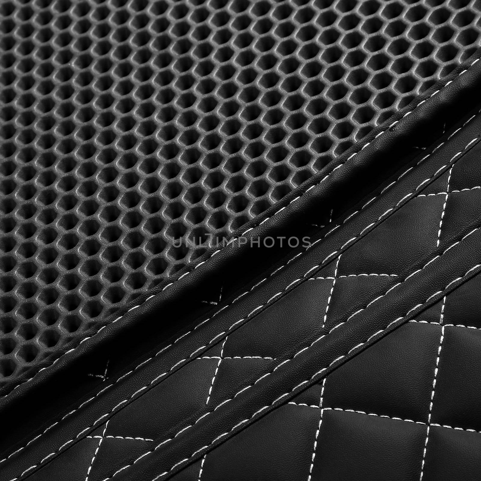 Texture of black leather background with square pattern and stitch, macro