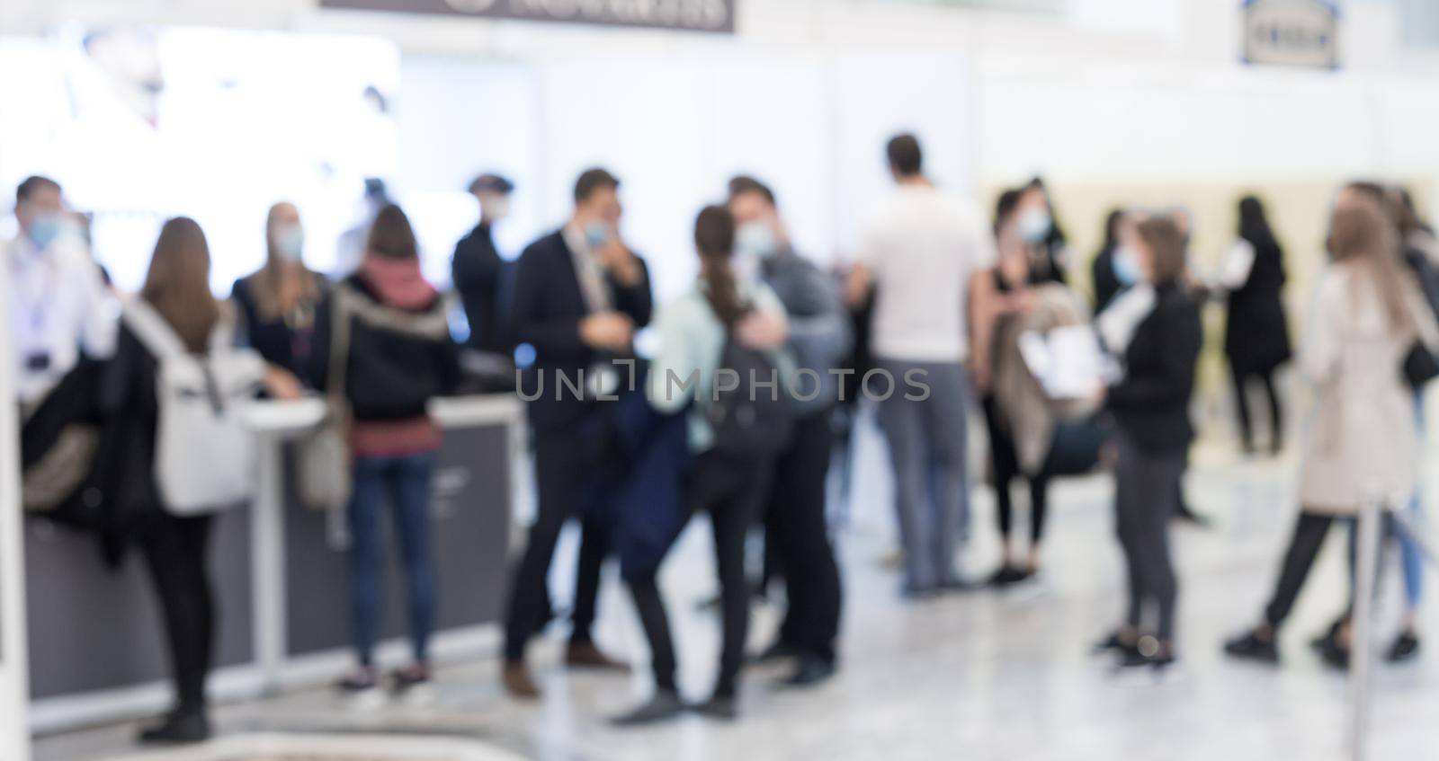 Abstract blured people at exhibition hall of expo event trade show. Business convention show or job fair. Business concept background. by kasto