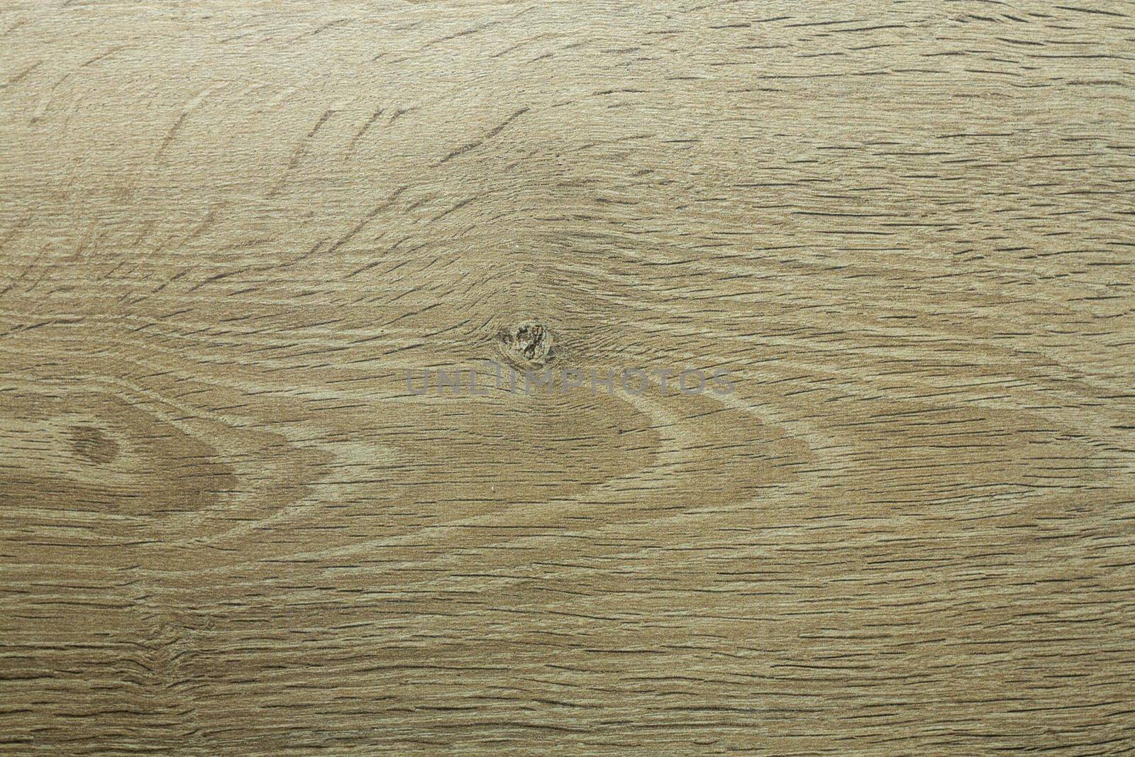 Wood texture. Wooden board close up. The cracks are deep. Laminate flooring. Tree rings in a cut.