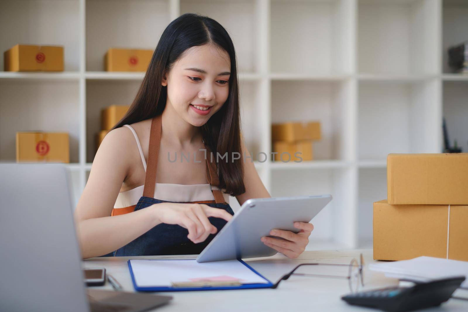 Asian small business owner working at home office. Business retail market and online sell marketing delivery, SME e-commerce concept. by itchaznong